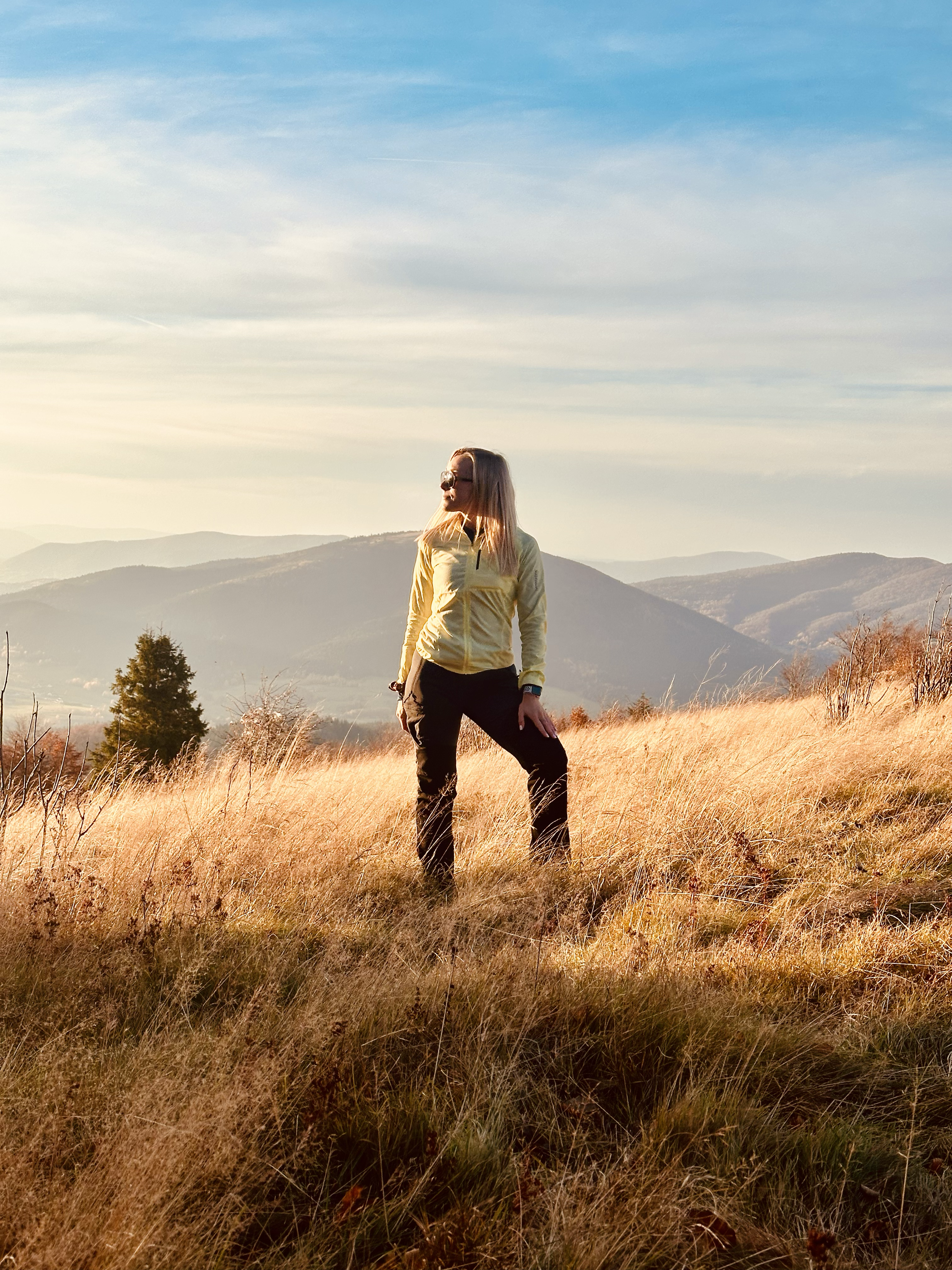 Portrait in a mountain landscape at sunset