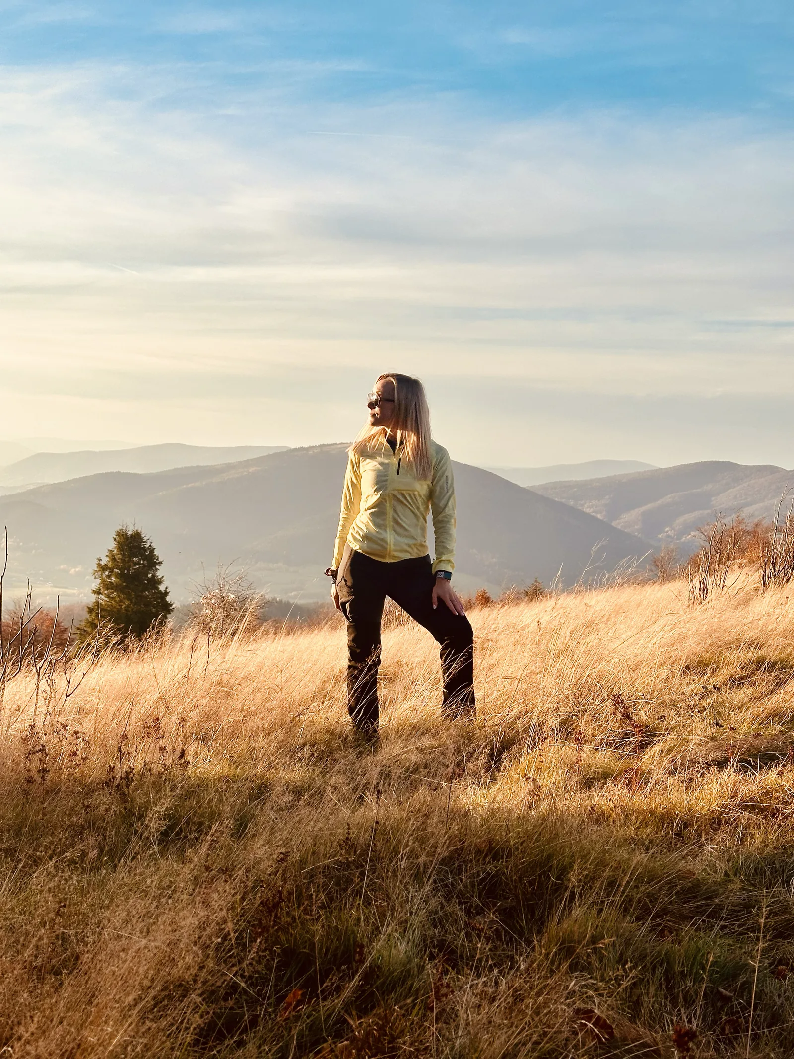 Portrait in a mountain landscape at sunset