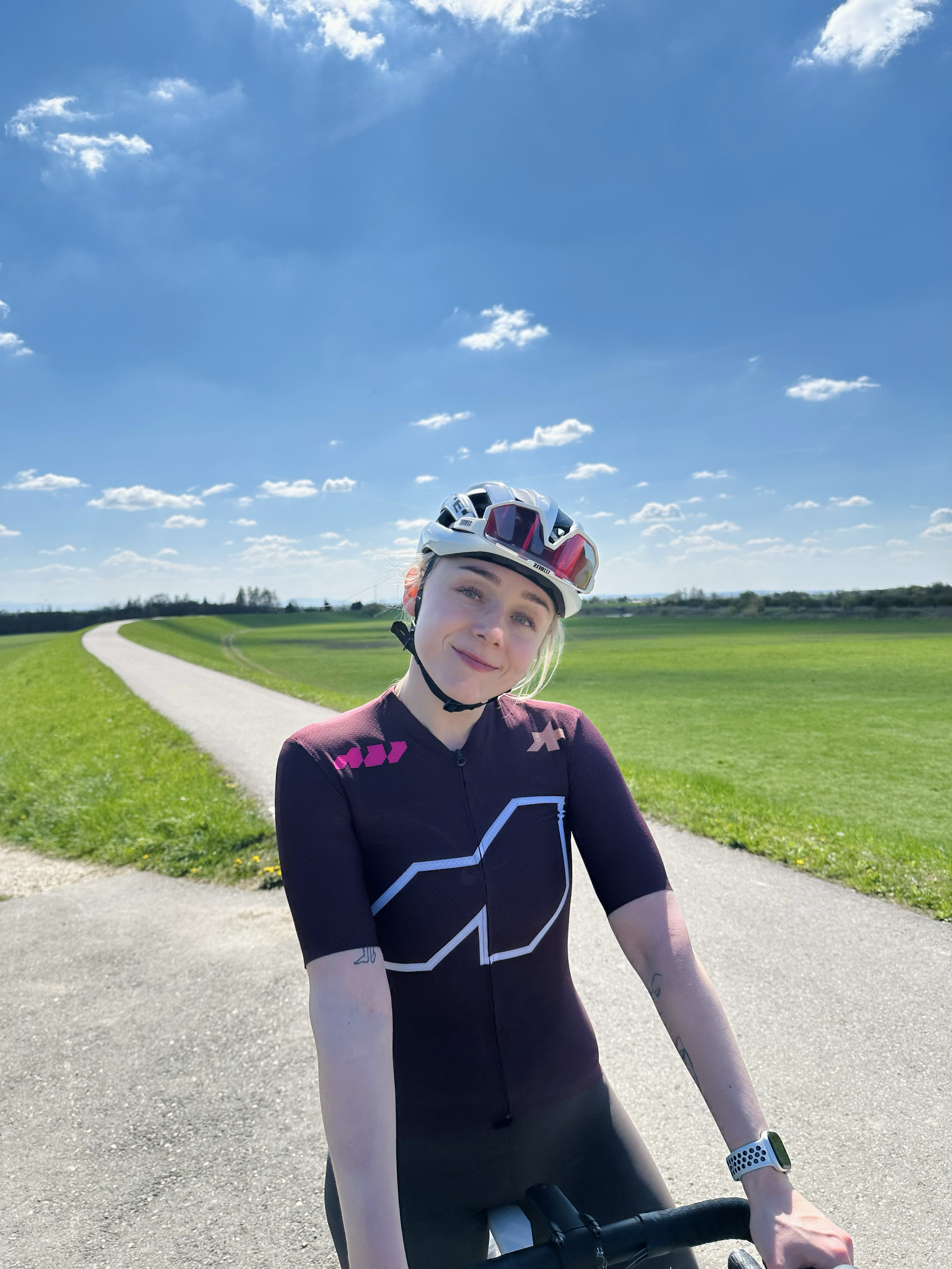 Portrait on a bike ride under a blue sky